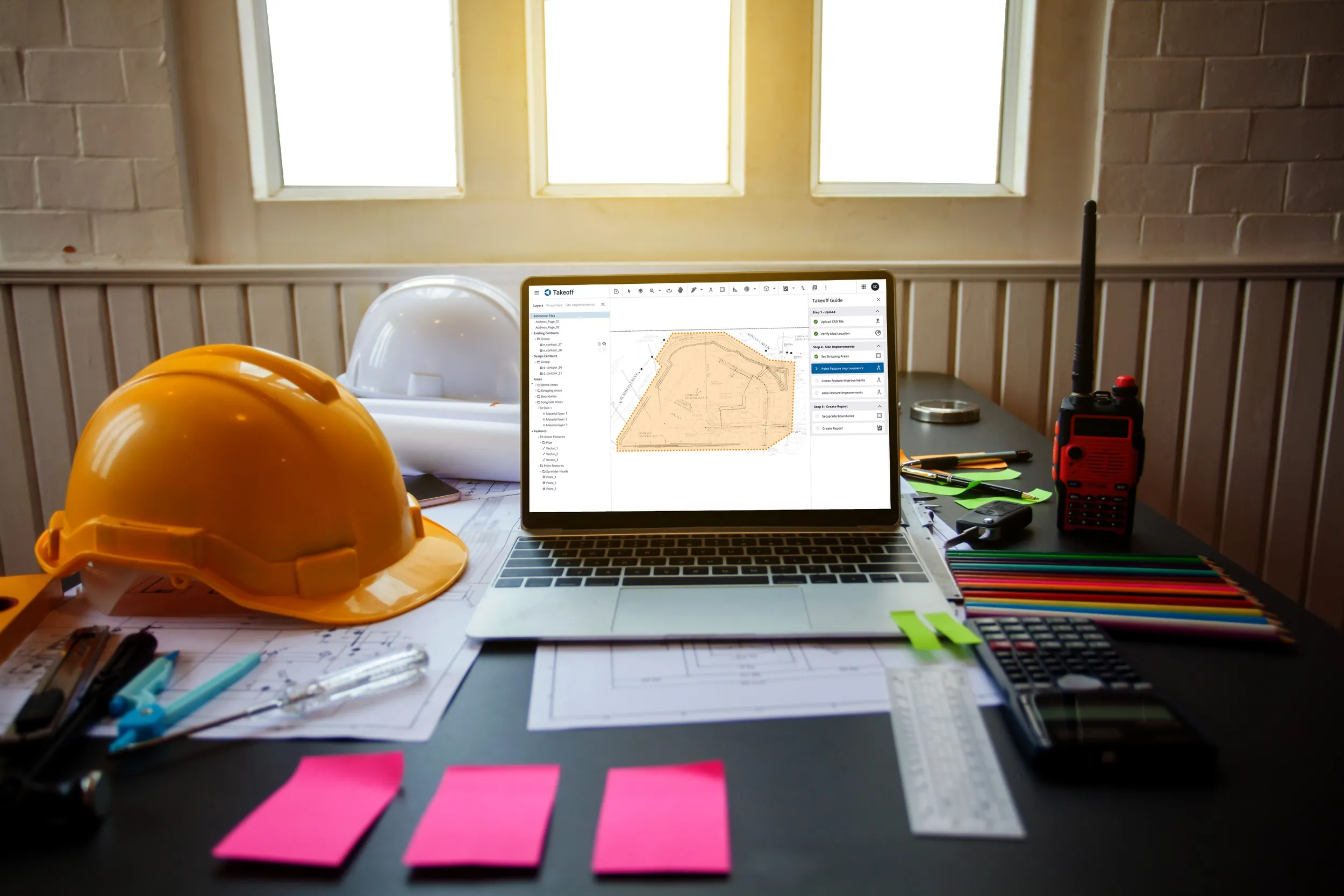 Trimble Takeoff estimation software running on a laptop at a construction desk